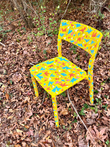 Janinge yellow “IKEA” chair TM art pattern.